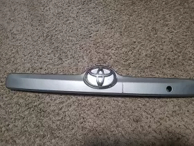 76801-02130 TOYOTA Rear Trunk Tailgate Molding Cosmic Corolla