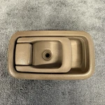 Nissan Frontier Right Inside Door Handle W/bezel Brown 1998-2004. Fixed Price $24.50.