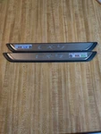 Mazda Cx-9 Rear Lighted Door Entry Panels Genuine Pair. Fixed Price $230.00.