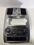 05-07 Chrysler 300 Center Dash Bezel W/ Climate Control & Clock Oem Silver Trim. Fixed Price $129.99.